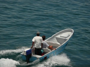 I ride a water taxi to Isla Carenero. Our nightime ride was on a similar dinky dingy.