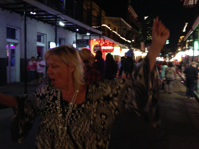 Julie dancing on Bourbon Street in New Orleans