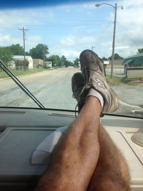 Scott's feet on dash, driving through Oklahoma